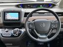 フリードハイブリッド ハイブリッド・Ｇホンダセンシング　純正ナビ　ＣＤ／ＤＶＤ／ＤＴＶ／Ｂｌｕｅｔｏｏｔｈ　バックカメラ　両側パワースライドドア　レーダークルーズコントロール　純正ホイール付きサマータイヤ積込　ＬＥＤオートライト　前後ドラレコ　ＥＴＣ（5枚目）