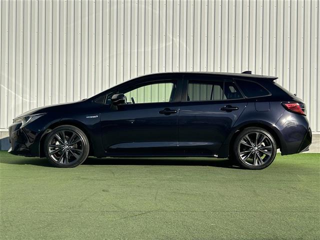 カローラツーリング ハイブリッド ダブルバイビー 禁煙車 純正9型ディスプレイオーディオ トヨタセーフティーセンス バックカメラ ブラインドスポットモニター 革巻きステアリング ステアリングヒーター シートヒーター エアーシート LEDヘッドライト(7枚目)