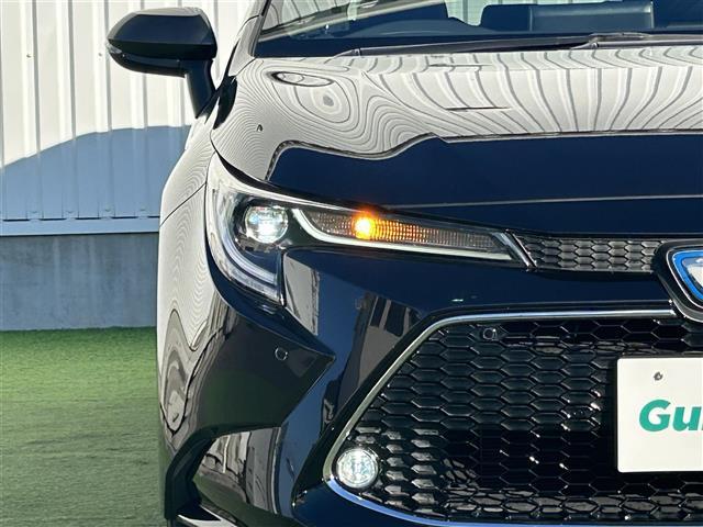 カローラツーリング ハイブリッド ダブルバイビー 禁煙車 純正9型ディスプレイオーディオ トヨタセーフティーセンス バックカメラ ブラインドスポットモニター 革巻きステアリング ステアリングヒーター シートヒーター エアーシート LEDヘッドライト(11枚目)