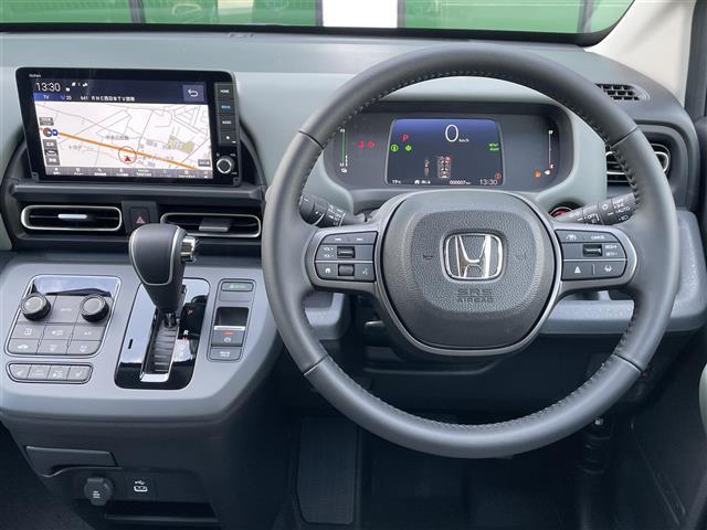フリード e:HEVクロスター 登録済未使用車 純正9型ナビ バックカメラ ホンダセンシング 両側パワースライドドア シートヒーター ブラインドスポットモニター LEDライト 革巻きステアリング ステアリングリモコン スマートキー(7枚目)