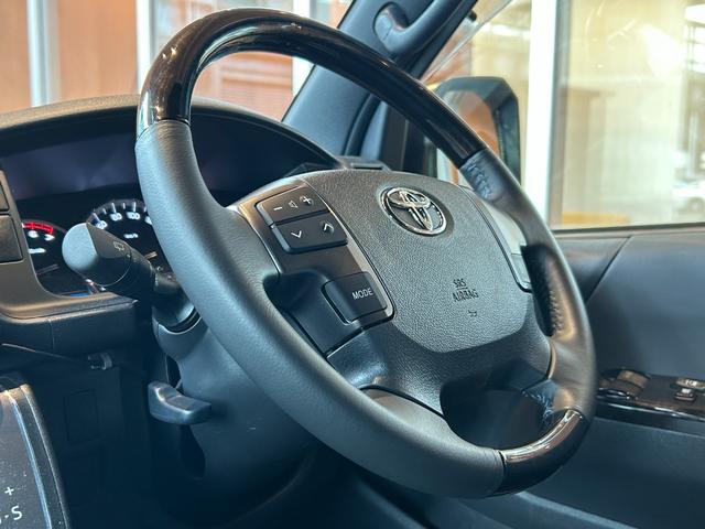 ハイエースバン スーパーGL ダークプライムII 衝突軽減システム LKA 社外ナビ バックカメラ 両側パワースライド LEDヘッドライト 社外LEDテールランプ フロントバンパーガード 17インチAWラギッドテレーンタイヤ 社外ベッドキット ETC(25枚目)