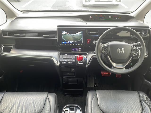 ステップワゴンスパーダ スパーダハイブリッド　Ｇ・ＥＸ　ホンダセンシング　純正９インチナビ　Ｂｌｕｅｔｏｏｔｈオーディオ　ＤＶＤ再生　ＨＤＭＩ　ＵＳＢ　マルチビューモニター　後席フリップダウンモニター　両側パワースライド　アダプティブクルーズコントロール　車高調　ＬＥＤ（3枚目）