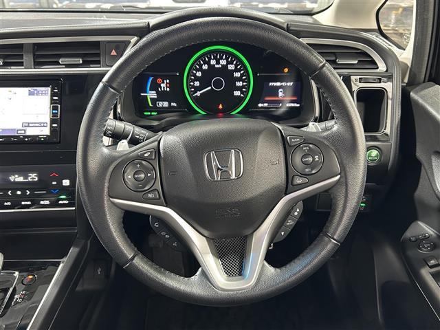 シャトル ハイブリッド メモリナビ 運転席助手席エアバッグ AAC 地デジ Bモニ 盗難防止システム VSA AUX 車線逸脱警報 シートヒーター ナビTV エアバッグ キーレス ABS スマートキー パワーウィンドウ(23枚目)