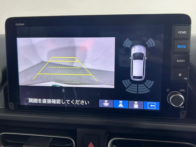 フリード ｅ：ＨＥＶクロスター　登録済未使用車　純正９ｉｎｃナビＴＶ　Ｂカメラ　レーダークルーズ　衝突軽減Ｂ　レーンアシスト　ブラインドＳＭ　両側パワースライドドア　ハーフレザー　シートヒーター　クリアランスソナー　ＬＥＤライト（5枚目）