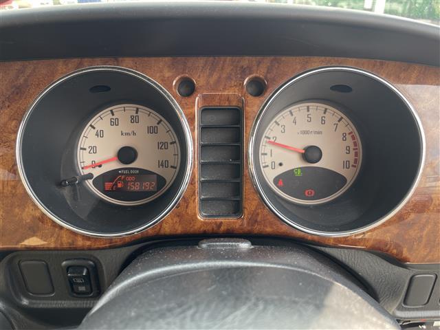 ミラジーノ ジーノ　禁煙車　５速ＭＴ　社外オーディオ　ＥＴＣ　ブラウンウッドインテリア　ウッドコンピステアリング　ハーフレザーシート　電動格納ミラー　メカニカルキー　スペアキー　純正ホイールカバー　取扱説明書　保証書（10枚目）