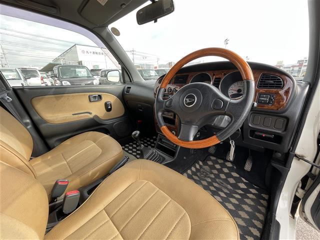 ミラジーノ ジーノ　禁煙車　５速ＭＴ　社外オーディオ　ＥＴＣ　ブラウンウッドインテリア　ウッドコンピステアリング　ハーフレザーシート　電動格納ミラー　メカニカルキー　スペアキー　純正ホイールカバー　取扱説明書　保証書（18枚目）