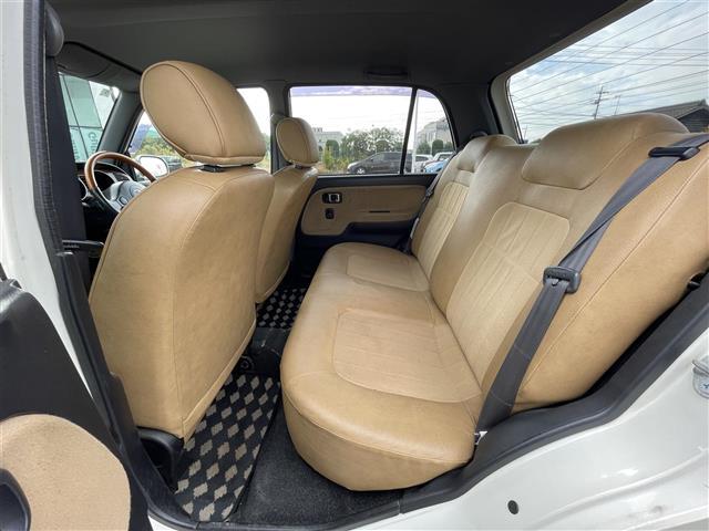 ミラジーノ ジーノ　禁煙車　５速ＭＴ　社外オーディオ　ＥＴＣ　ブラウンウッドインテリア　ウッドコンピステアリング　ハーフレザーシート　電動格納ミラー　メカニカルキー　スペアキー　純正ホイールカバー　取扱説明書　保証書（24枚目）