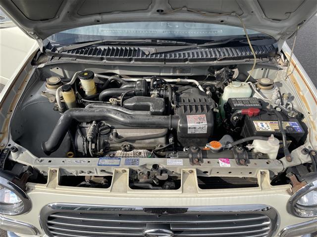 ミラジーノ ジーノ　禁煙車　５速ＭＴ　社外オーディオ　ＥＴＣ　ブラウンウッドインテリア　ウッドコンピステアリング　ハーフレザーシート　電動格納ミラー　メカニカルキー　スペアキー　純正ホイールカバー　取扱説明書　保証書（40枚目）