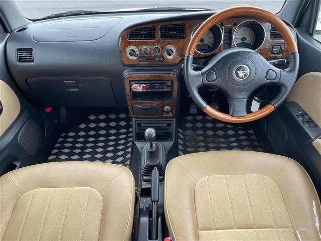 ミラジーノ ジーノ　禁煙車　５速ＭＴ　社外オーディオ　ＥＴＣ　ブラウンウッドインテリア　ウッドコンピステアリング　ハーフレザーシート　電動格納ミラー　メカニカルキー　スペアキー　純正ホイールカバー　取扱説明書　保証書（42枚目）