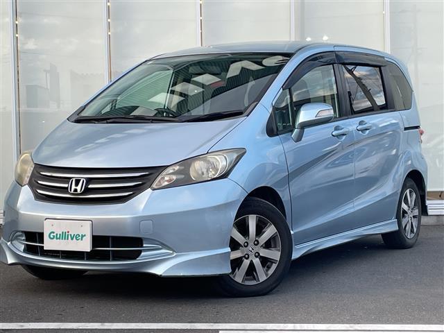 フリード G エアロ Lパッケージ 純正ナビ ワンセグTV Gathers製後席フリップダウンモニター 片側パワースライドドア バックカメラ ETC 純正アルミホイール 純正フロアマット 電動格納ミラー ドアバイザー(10枚目)