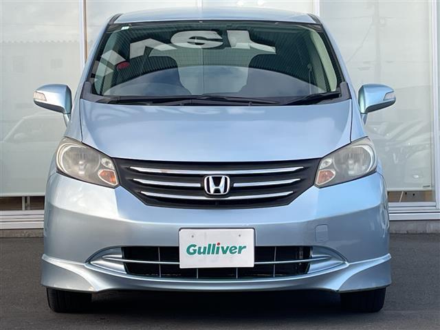 フリード G エアロ Lパッケージ 純正ナビ ワンセグTV Gathers製後席フリップダウンモニター 片側パワースライドドア バックカメラ ETC 純正アルミホイール 純正フロアマット 電動格納ミラー ドアバイザー(11枚目)