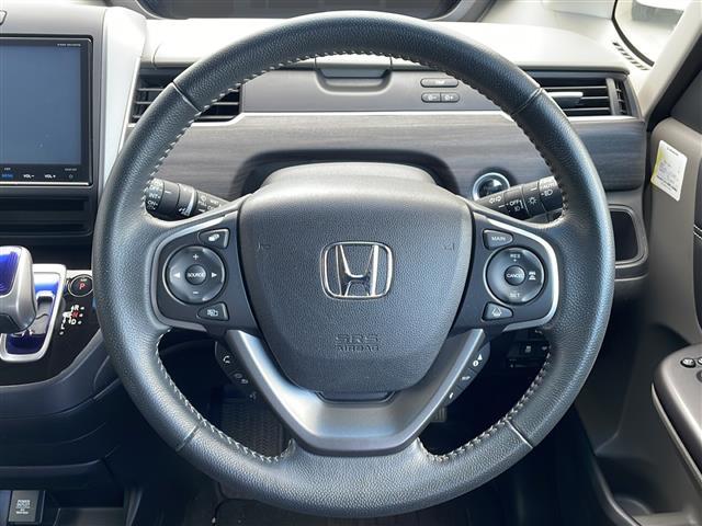 フリード＋ハイブリッド ハイブリッドＥＸ　禁煙車／純正ナビ（ＣＤ／ＤＶＤ／フルセグＴＶ／Ｂｌｕｅｔｏｏｔｈ）／バックカメラ／ビルトインＥＴＣ／シートヒーター／ドライブレコーダー／両側パワースライドドア／革巻きステアリング（23枚目）