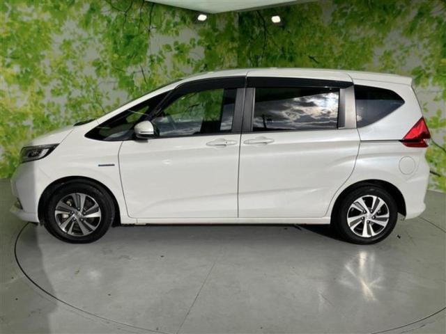 フリードハイブリッド ハイブリッドＧホンダセンシング　保証書／純正　９インチ　ＳＤナビ／フリップダウンモニター　純正　１１．６インチ／ホンダセンシング／両側電動スライドドア／シートヒーター　前席／車線逸脱防止支援システム／シート　ハーフレザー　ＤＶＤ再生（2枚目）