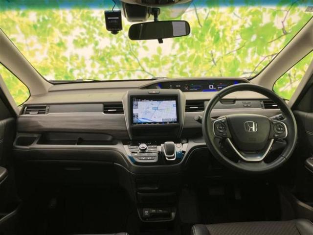 フリードハイブリッド ハイブリッドＧホンダセンシング　保証書／純正　９インチ　ＳＤナビ／フリップダウンモニター　純正　１１．６インチ／ホンダセンシング／両側電動スライドドア／シートヒーター　前席／車線逸脱防止支援システム／シート　ハーフレザー　ＤＶＤ再生（4枚目）