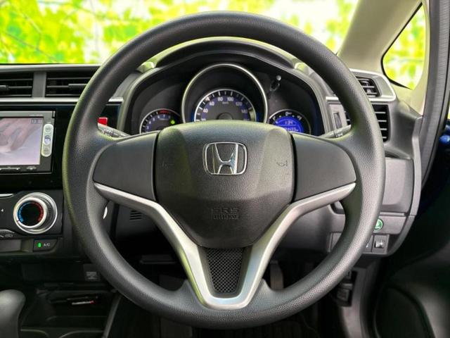 フィット １３Ｇ・Ｆパッケージ　保証書／純正　ＳＤナビ／Ｂｌｕｅｔｏｏｔｈ接続／ＥＢＤ付ＡＢＳ／横滑り防止装置／アイドリングストップ／ワンセグＴＶ／ＤＶＤ／エアバッグ　運転席／エアバッグ　助手席／衝突安全ボディ／パワーウインドウ（13枚目）