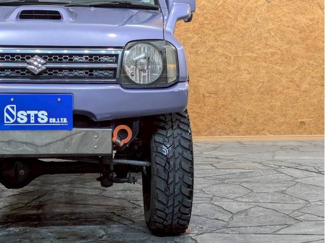 ジムニー ＸＧ　ユーザー様仕入　５ＭＴ　リフトアップ　タニグチマフラー　社外ステップ　ラテラルロッド　社外１６インチＡＷ　デジタルインナーミラー　社外ナビ　フルセグＴＶ　シートカバー　牽引フック　リモコンキー　ＥＴＣ（11枚目）