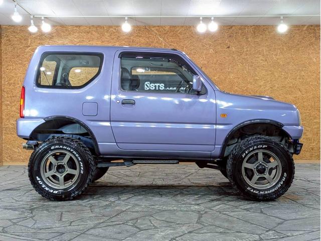 ジムニー ＸＧ　ユーザー様仕入　５ＭＴ　リフトアップ　タニグチマフラー　社外ステップ　ラテラルロッド　社外１６インチＡＷ　デジタルインナーミラー　社外ナビ　フルセグＴＶ　シートカバー　牽引フック　リモコンキー　ＥＴＣ（13枚目）