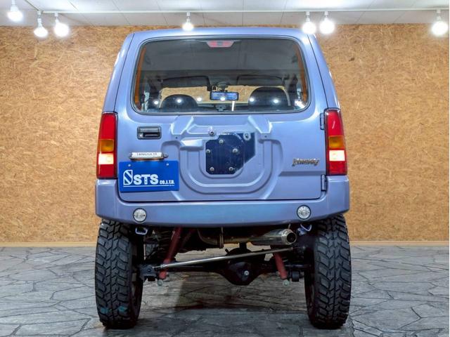 ジムニー ＸＧ　ユーザー様仕入　５ＭＴ　リフトアップ　タニグチマフラー　社外ステップ　ラテラルロッド　社外１６インチＡＷ　デジタルインナーミラー　社外ナビ　フルセグＴＶ　シートカバー　牽引フック　リモコンキー　ＥＴＣ（16枚目）