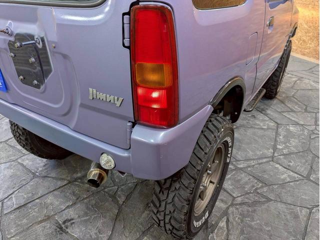 ジムニー ＸＧ　ユーザー様仕入　５ＭＴ　リフトアップ　タニグチマフラー　社外ステップ　ラテラルロッド　社外１６インチＡＷ　デジタルインナーミラー　社外ナビ　フルセグＴＶ　シートカバー　牽引フック　リモコンキー　ＥＴＣ（26枚目）