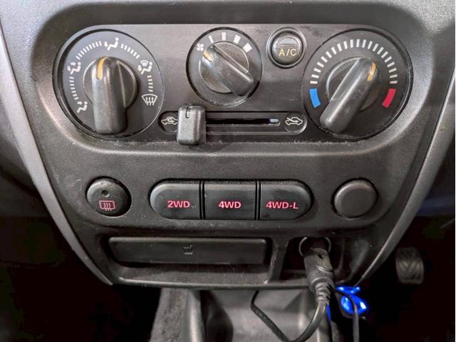 ジムニー ＸＧ　ユーザー様仕入　５ＭＴ　リフトアップ　タニグチマフラー　社外ステップ　ラテラルロッド　社外１６インチＡＷ　デジタルインナーミラー　社外ナビ　フルセグＴＶ　シートカバー　牽引フック　リモコンキー　ＥＴＣ（41枚目）