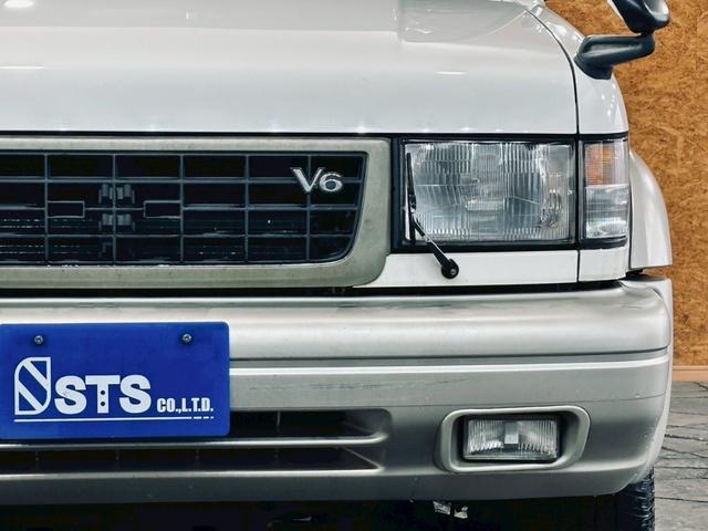 ビッグホーン ハンドリングバイロータス　ロング　ユーザー様直接仕入　サンルーフ　ガナドールマフラー　インチアップ　社外１６ＡＷ　Ａ／Ｔタイヤ　ルーフスポイラー　サイドステップ　社外ナビ　フルセグＴＶ　バックカメラ　シートヒーター　スペアキー　ＥＴＣ（11枚目）