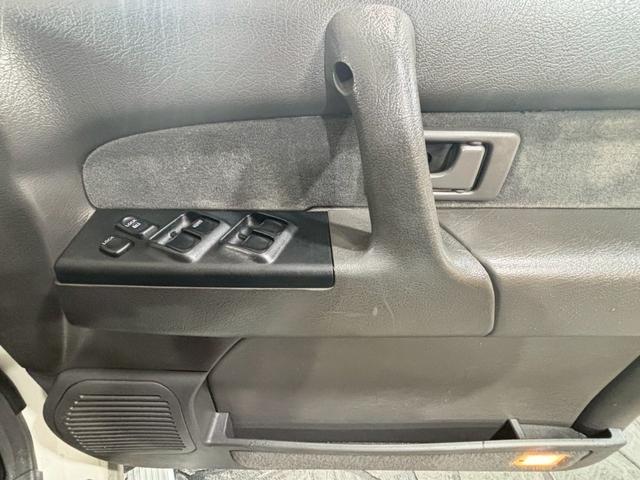 ビッグホーン ハンドリングバイロータス　ロング　ユーザー様直接仕入　サンルーフ　ガナドールマフラー　インチアップ　社外１６ＡＷ　Ａ／Ｔタイヤ　ルーフスポイラー　サイドステップ　社外ナビ　フルセグＴＶ　バックカメラ　シートヒーター　スペアキー　ＥＴＣ（32枚目）