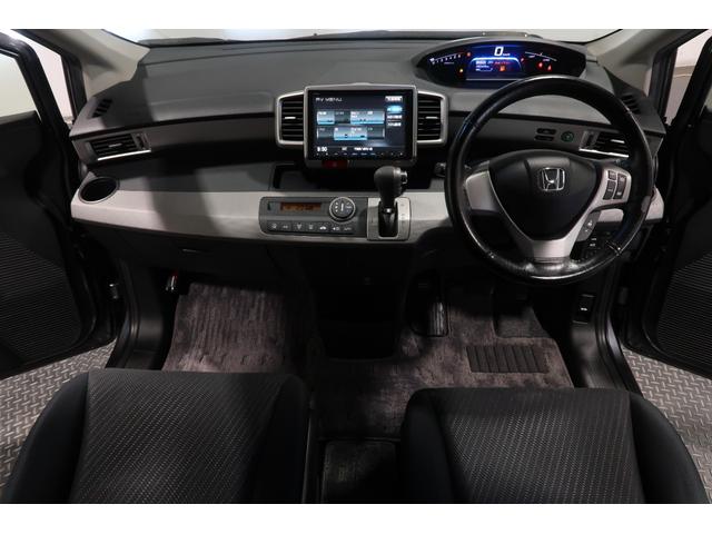 フリードハイブリッド ジャストセレクション 1年保証付 Bカメラ ナビ ETC 両側スライド片側電動ドア セキュリティー 横滑り防止機能 オートクルーズ 地デジ エアバック ウォークスルー DVD再生可能 キーレスエントリー PS 3列 ABS(7枚目)