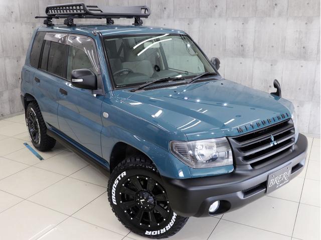 パジェロイオ パールパッケージ　ナビエディション　４ＷＤ　ブレラＯＧカスタム　新品社外ＡＷ　新品マッドテレーンタイヤ　新品ルーフラック＆新品ベースキャリア　インナーブラックヘッドライト　テールランプブラックアウト　マットブラック塗分　ＥＴＣ（4枚目）