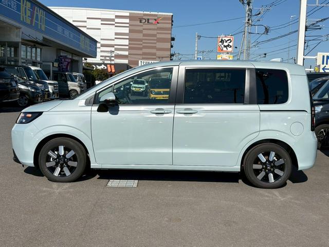 フリード e:HEVエアー EX登録済未使用車 マルチビューカメラ 純正11.4インチナビ ETC2.0 BSI・後退出庫サポート アダプティブドライビングビーム 両側電動スライドドア シートヒーター レザー調コンビシート リアクーラー パーキングセンサー 専用アルミ(11枚目)