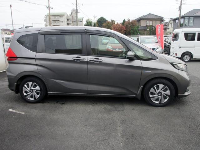 フリードハイブリッド ハイブリッド・Ｇホンダセンシング　６人　ブレーキサポート　後期　９インチナビ　フルセグＴＶ　１１．６インチフリップダウンモニター　バックカメラ　両側電動スライドドア　ＬＥＤライト　左アダクティブクルーズコントロール　ＥＴＣ（7枚目）