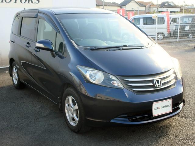 フリード Ｇ　ジャストセレクション　７人乗り　ナビ　フルセグＴＶ　ブルートゥース対応　バックカメラ　１０．２インチフリップダウンモニター　スマートキー　両側電動スライドドア　ＥＴＣ　電動格納ミラー（11枚目）