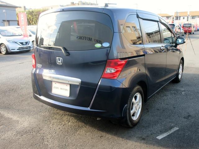 フリード Ｇ　ジャストセレクション　７人乗り　ナビ　フルセグＴＶ　ブルートゥース対応　バックカメラ　１０．２インチフリップダウンモニター　スマートキー　両側電動スライドドア　ＥＴＣ　電動格納ミラー（15枚目）