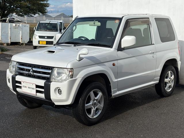 パジェロミニ ＶＲ　４ＷＤ　ターボ　修復歴無　車検２年付　ＣＤ　ＡＵＸ接続　タイミングベルト交換済　アルミホイール　キーレスキー　電動格納ドアミラー　ドアバイザー　ＡＢＳ　プライバシーガラス　レベライザー　フルフラット（7枚目）