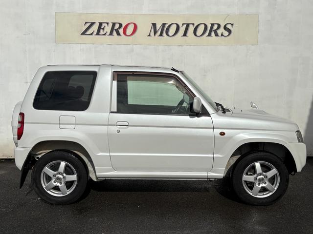 パジェロミニ ＶＲ　４ＷＤ　ターボ　修復歴無　車検２年付　ＣＤ　ＡＵＸ接続　タイミングベルト交換済　アルミホイール　キーレスキー　電動格納ドアミラー　ドアバイザー　ＡＢＳ　プライバシーガラス　レベライザー　フルフラット（9枚目）