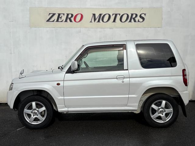 パジェロミニ ＶＲ　４ＷＤ　ターボ　修復歴無　車検２年付　ＣＤ　ＡＵＸ接続　タイミングベルト交換済　アルミホイール　キーレスキー　電動格納ドアミラー　ドアバイザー　ＡＢＳ　プライバシーガラス　レベライザー　フルフラット（11枚目）