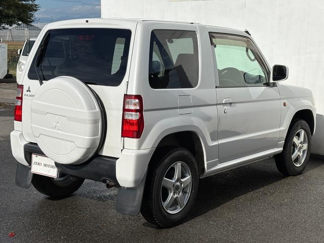 パジェロミニ ＶＲ　４ＷＤ　ターボ　修復歴無　車検２年付　ＣＤ　ＡＵＸ接続　タイミングベルト交換済　アルミホイール　キーレスキー　電動格納ドアミラー　ドアバイザー　ＡＢＳ　プライバシーガラス　レベライザー　フルフラット（17枚目）