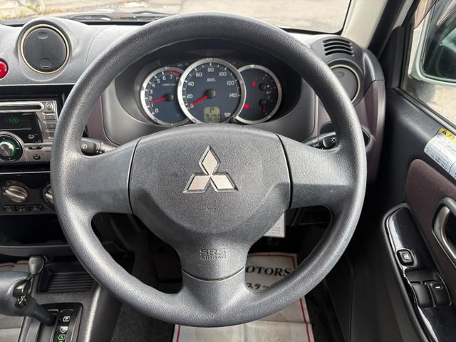 パジェロミニ ＶＲ　４ＷＤ　ターボ　修復歴無　車検２年付　ＣＤ　ＡＵＸ接続　タイミングベルト交換済　アルミホイール　キーレスキー　電動格納ドアミラー　ドアバイザー　ＡＢＳ　プライバシーガラス　レベライザー　フルフラット（25枚目）