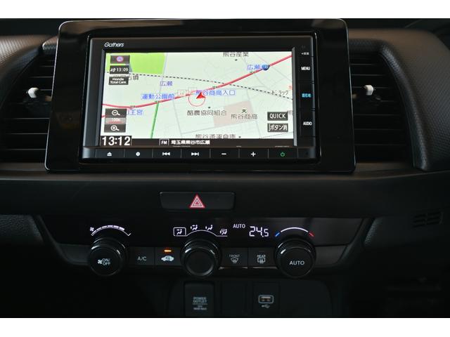 フィット e:HEVベーシック ホンダセンシング 純正ナビ Rカメラ 障害物センサー LEDライト ホンダコネクト カーテンエアバッグ CMBS USBポート ワンオーナー車 セキュリティアラーム アイドリングストップ スマートキー(14枚目)