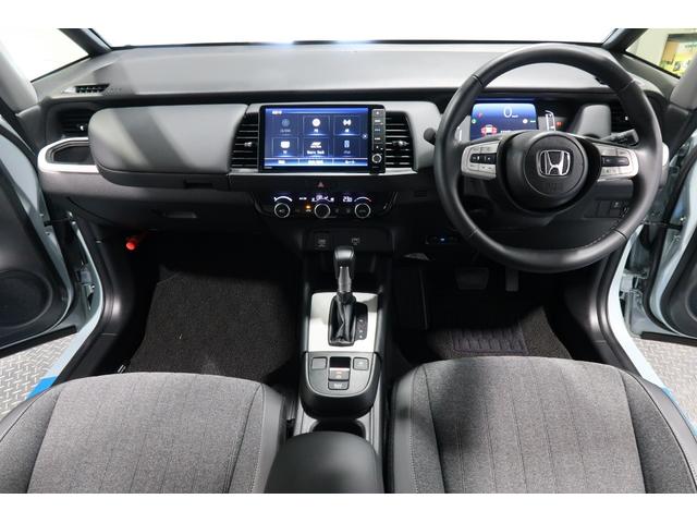 フィット ｅ：ＨＥＶホーム　２年保証付　デモカー　運転支援　ドラレコ　ナビ　ＥＴＣ　先進ライト　コーナーソナー　サイドカーテンエアバック　Ｂカメ　ＷＳＲＳ　スマートキープッシュスタート　フルオートエアコン　ＬＥＤ　地デジ　ＶＳＡ（12枚目）