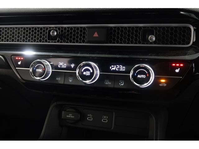 シビック ｅ：ＨＥＶＥＸ　２年保証付　デモカー　運転支援　ドラレコ　ナビ　Ｂカメラ　ＥＴＣ　サンルーフ　パーキングセンサー　パワーシート　ＥＳＣ　ＵＳＢ接続　オートライト　サイドカーテンエアバック　フルセグ　シートヒーター（14枚目）