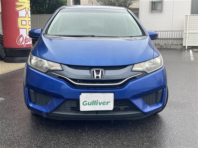 フィット 13G・Fパッケージ ワンオーナー車 スマ-トキ- VSA ETC付き 地デジTV 助手席エアバッグ Rカメラ オートエアコン エアバック PS キ-フリ- PW ABS TVナビ SD アイドリングSTOP(2枚目)