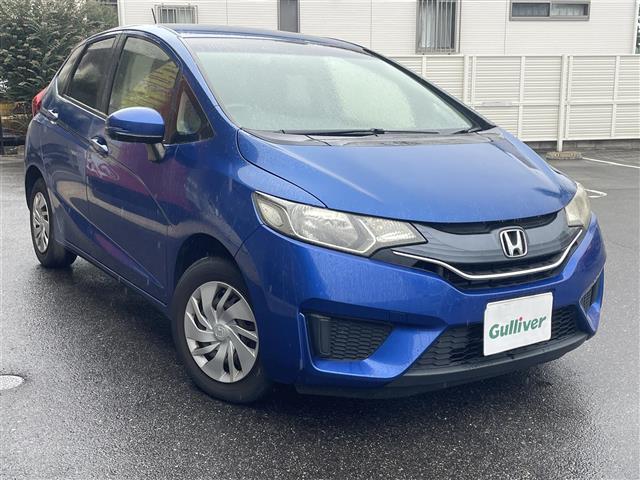 フィット 13G・Fパッケージ ワンオーナー車 スマ-トキ- VSA ETC付き 地デジTV 助手席エアバッグ Rカメラ オートエアコン エアバック PS キ-フリ- PW ABS TVナビ SD アイドリングSTOP(3枚目)