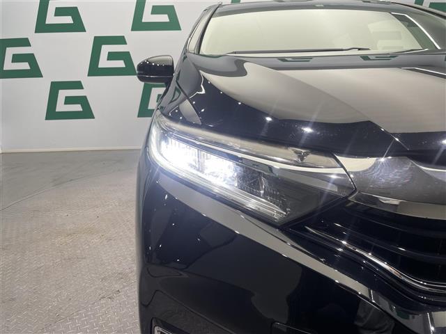 シャトル ハイブリッドZ ホンダセンシング 禁煙車 ホンダセンシング 純正8インチナビ バックカメラ クルーズコントロール 純正フロアマット 前席シートヒーター LEDヘッドライト オートライト 革巻きステアリング ETC 純正アルミホイール(35枚目)
