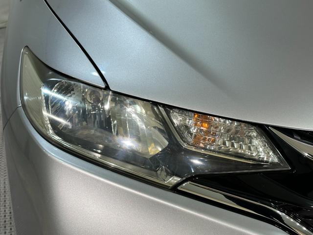 フィット 13G・F ETC スマートキー 電動格納ミラー MT 盗難防止システム 衝突安全ボディ ABS ESC CD エアコン パワーウインドウ パワーステアリング エアバッグ USB ミュージックプレイヤー接続可(21枚目)