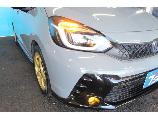 フィット ｅ：ＨＥＶ　ＲＳ　禁煙車／ホンダセンシング／純正９インチナビ／ハーフレザーシート／バックカメラ／ＥＮＫＥＩ１６インチホイール／クリアランスソナー／レーダークルーズコントロール／レーンキープアシスト／ＬＥＤヘッドライト（19枚目）