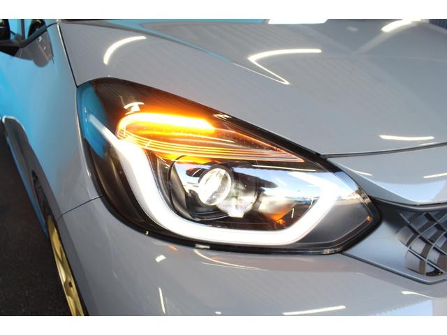フィット ｅ：ＨＥＶ　ＲＳ　禁煙車／ホンダセンシング／純正９インチナビ／ハーフレザーシート／バックカメラ／ＥＮＫＥＩ１６インチホイール／クリアランスソナー／レーダークルーズコントロール／レーンキープアシスト／ＬＥＤヘッドライト（20枚目）