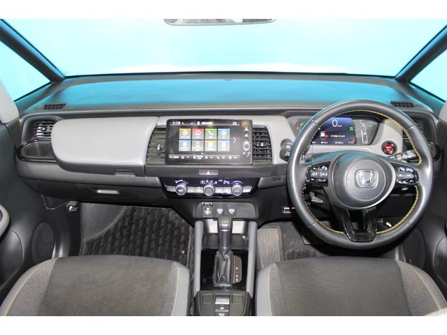 フィット ｅ：ＨＥＶ　ＲＳ　禁煙車／ホンダセンシング／純正９インチナビ／ハーフレザーシート／バックカメラ／ＥＮＫＥＩ１６インチホイール／クリアランスソナー／レーダークルーズコントロール／レーンキープアシスト／ＬＥＤヘッドライト（6枚目）