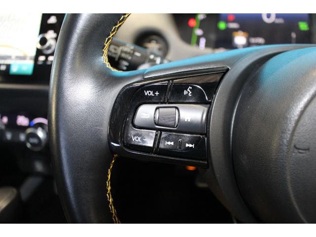 フィット ｅ：ＨＥＶ　ＲＳ　禁煙車／ホンダセンシング／純正９インチナビ／ハーフレザーシート／バックカメラ／ＥＮＫＥＩ１６インチホイール／クリアランスソナー／レーダークルーズコントロール／レーンキープアシスト／ＬＥＤヘッドライト（65枚目）