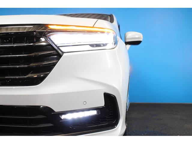 オデッセイハイブリッド ｅ：ＨＥＶアブソルート・ＥＸ　純正９インチナビ／全周囲カメラ／禁煙／両側電動スライドドア／ホンダセンシング／パワーバックドア／シートヒーター／アダプティブクルーズコントロール／ドラレコ／ＬＥＤヘッドライト／ＨＤＭＩ接続／ＥＴＣ／（69枚目）