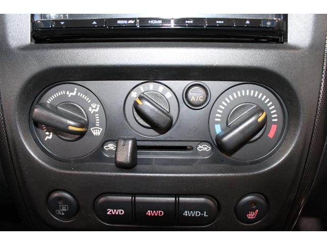 ジムニー クロスアドベンチャー　禁煙車／８型／リフトアップ／社外テールランプ／社外ナビ７型／シートヒーター／ターボタイマー／バックカメラ／４ＷＤ／ＥＴＣ／キーレス／スマートキー／ブルートゥース／電動格納ミラー／ＤＶＤ／寒冷地仕様（63枚目）